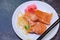 Selective Focused Japanese salmon sashimi fresh fatty salmon meat decorated with grated turnip and carrot in white dish on
