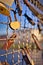 Selective vertical shot of rusty love padlocks attached to a  fence, symbolizing unbreakable love