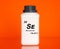 Selenium Se chemical element in a laboratory plastic container