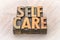 Self-care word abstract in wood type