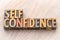 Self confidence word abstract in wood type