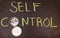 Self control concept. Handwriting self control inscription text on chalkboard with arabic compass