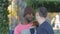 Self-defense workout with trainer outdoors. Young african american male athlete in knitted hat practicing self-defense