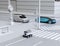 Self-driving delivery robot moving on the roadside. Delivery minivan and self-driving sedan passing the crossroad