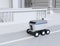 Self-driving delivery robot moving on the street