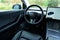 Self Driving Tesla Car Premium Black Interior. Wood trim, leather seats, panoramic sunroof, modern multimedia.