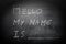 Self Introduction - Hello, My name is ... written on a blackboard