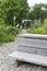 A self-made wooden bench invites you to linger in the small wild vegetable garden on the old overgrown industrial wasteland in