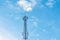 Self support type telecommunication tower against blue sky background.