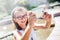 Selfie. Beautiful cute young girl with braces and glasses laughing for a selfie