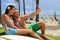 Selfie couple taking phone picture on Hawaii Waikiki beach travel vacation. Young people surfers lifestyle relaxing in Honolulu