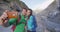 Selfie couple taking phone self-portrait on New Zealand by Franz Josef Glacier