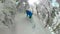 SELFIE: Extreme male snowboarder carves out of a dangerous snowy forest in Alps.