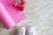 Selfie of feet sporty girl with yoga mat and dumbbells on concrete floor. Fitness and workout, Healthy