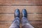 Selfie of foot and legs with black derby shoes seen from above