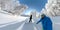 SELFIE: Freeride snowboarding couple riding fresh powder snow in sunny mountains