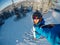 Selfie Guy sportsman goes on normal skiing on ski slope with action camera Sheregesh