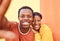 Selfie, love and memories with a black couple posing for a photograph together on a color wall background. Portrait