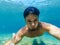 Selfie men diver under water with a fun happy face in sea