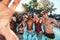 Selfie, peace sign and friends at pool party having fun partying on new year. Swimming celebration, water event and