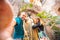 Selfie photo of couple man and woman hold statue of Juliet balcony in city Verona Italy. Travel concept