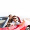 Selfie photo of young teen couple in convertible