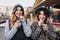 Selfie portrait of joyful fashionable girls having fun on sunny street in city. Stylish look, having fun, travelling