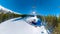 SELFIE: Snowboarding couple rides the chairlift and observe the snowy mountains