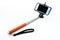 Selfie stick with an adjustable clamp on a white background