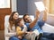 Selfie, tablet and happy family relax in a home together doing social media content on the internet or online. App