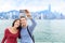 Selfie tourist couple taking picture in Hong Kong