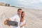 Selfie vacation beach couple romantic honeymoon. Happy young woman and man taking photo with phone - newlyweds on
