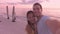 Selfie video by romatic beautiful young couple on beach at sunset Couple relaxing on summer honeymoon vacation travel