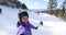 Selfie video of woman going skiing on ski holidays vacation in mountains, Winter landscape with snow. Happy cheerful