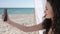 Selfphoto Young woman on beach, Mobile phone removes holiday pictures, smiling girl Does selfie on background sea ocean
