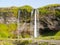 Seljaland Waterfall, aka Seljalandsfoss, front view on sunny day, Iceland