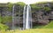 Seljalandfoss, Iceland - July 29, 2021: Seljalandsfoss is one of the best known waterfalls in Iceland. The waterfall drops 60