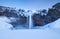 Seljalandsfoss waterfall, Iceland. Icelandic winter landscape.  High waterfall and rocks. Snow and ice. Powerful stream of water f