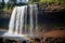 Seljalandsfoss waterfall in South Iceland with rainbow, Waterfall in Kauai With Rainbow and Bird Overhead, AI Generated