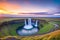 Seljalandsfoss waterfall at sunset, Iceland made with Generative AI