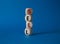 Sell symbol. Concept word Sell on wooden cubes. Beautiful blue background. Business and Sell concept. Copy space