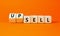 Sell or upsell symbol. Concept word Sell Upsell on wooden cubes. Beautiful orange table orange background. Business Sell or Upsell