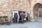 The seller - an Arab stands near his shop with souvenirs near the entrance to the medieval fortress Ash Shubak, standing on a hill