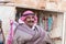 The seller - an Arab stands near his shop with souvenirs near the entrance to the medieval fortress Ash Shubak, standing on a hill