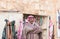 The seller - an Arab stands near his shop with souvenirs near the entrance to the medieval fortress Ash Shubak, standing on a hill