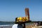 The seller of fruits and shrimp is walking on the sand of the beach of Manzanillo Colima.