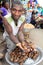 Seller of giant snails on African market