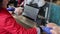 the seller scans the goods at the checkout in the supermarket. close up of female hands scanning barcode of meat