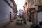 Seller sells vegetables and fruit from carts in the narrow streets of the ancient Indian city of Varanasi