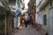 Seller sells vegetables and fruit from carts in the narrow streets of the ancient Indian city of Varanasi